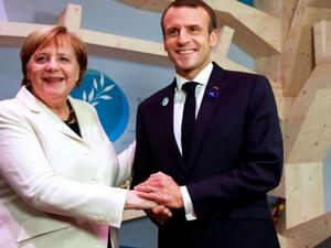  الرئيس الفرنسي إيمانويل ماكرون والمستشارة الألمانية أنغيلا ميركل