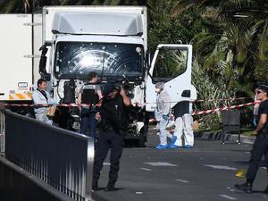 French police and security forces examine the remains of the delivery truck that Mohamed Lahouaiej Bouhlel drove into a crowd of people on Bastille Day. (AFP/File)
