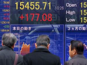 Japan's Nikkei 225 index fell 7.1 percent to 21,087.71 by early Tuesday afternoon, after a wild day for U.S. stock markets. (AFP)