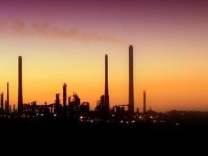 An oil refinery draws out the skyline. (Twitter)