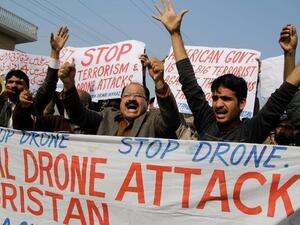 Activists from the Muttahida Shehri Mahaz shout slogans as they protest against a US drone attack in Multan on December 26, 2103. [AFP]