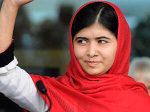 Malala Yousafzai waves during the official opening of Birmingham's library. [gaurdian]