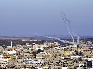Palestinians fire rockets at Israel from Gaza during last summer's conflict. (AFP/File)
