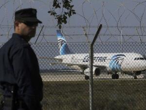 A shot of Cypriot police beside the hijacked aircraft in Cyprus. (Twitter)