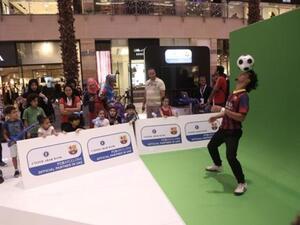 Free Styler wows the visitors by performing soccer tricks at the UAB stand organised for the bank's alliance with FC Barcelona Free Styler wows the visitors by performing soccer tricks at the UAB stand organised for the bank's alliance with FC Barcelona