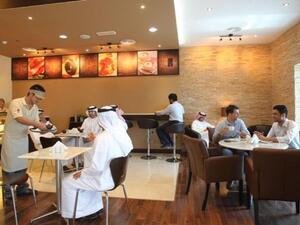 Customers relaxing in the coffee shop at Al Barsha Registration Centre of Emirates Identity Authority