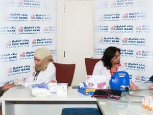 Gulf Bank employees during a blood test which occurs before donating blood