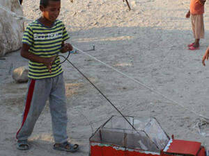 Kid playing at Ghor Al-Mazra’a