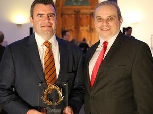 David Kerr, VP Etihad Cargo receives the award from Dr Kostas Iatrou, Managing Director, Air Transport News, during the presentation ceremony at the Araina Museum, Geneva