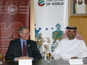 Mohammed Al Muallem and Dr. Peter Heath at the signing ceremony