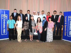 Abdulhakim Binherz, GM Legal Affairs, Fraud Prevention and Investigations with staff members at Emirates NBD staff Iftar