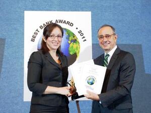 Ms. Dina Shoman, Executive Vice President of Branding at Arab Bank accepting the awards