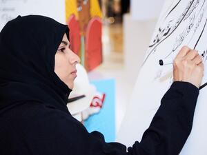 Award winning calligraphy artist, Narjes Noureddine.