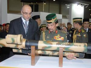 Sultan Hassanal Bolkiah, Sultan of Brunei visiting the group's booth