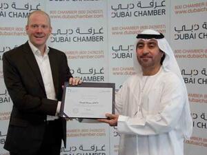Ben Churchill, Managing Director, Emrill receiving the Dubai Chamber CSR Label from H.E. Hisham Al Shirawi, 2nd Vice Chairman, Dubai Chamber