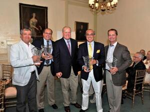 Team Emal 1 receive their trophies from twice Major Champion winner and respected NBC and Golf Channel golf analyst, Johnny Miller
