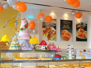 For one month, the assorted array of breads, buns and cakes are at reduced prices