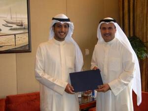 NUKS, Union President, Fahad T. Al Sebaie receives the sponsorship cheque from NBK Group Deputy CEO Isam Al Sager