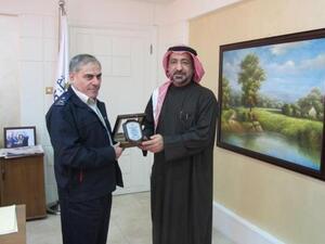 Ahmed Butti Ahmed exchanging gifts with Galib Al-Saraera, Director General of the Jordanian Customs