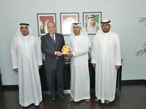 Abdulla Al Khaja receiving the award from Mohammed Sulman in the presence of Edris Behzad and Khalil Saqr