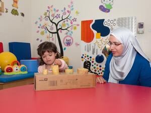 Zahrat Al Hayat and her mother enjoy playing together