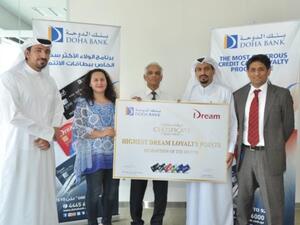 Doha Bank customer receives free air tickets from redeemed points