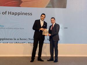 Dr. Adnan Chilwan, Group Chief Executive Officer at DIB, receiving the award