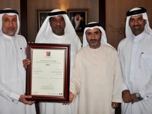 Ahmed Bin Saeed, Chairman of Dubai Airport Freezone receives the Dubai Award for Human Development from Mohammed Al Zarooni, Director General, Dubai Airport Freezone