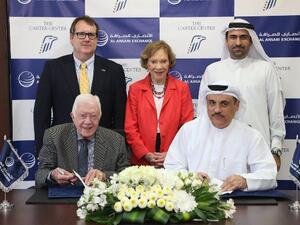 خلال توقيع الإتّفاقية بين الرئيس الأمريكي الأسبق جيمي كارتر، مؤسس مركز كارتر، ومحمد علي الأنصاري، الرئيس التنفيذي لشركة الأنصاري للصرافة