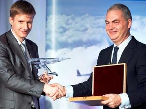 Alexei Bakirey, Chairman of the Committee for St Petersburg Transport-Transit Policy, and Thierry Antinori, Emirates Executive Vice President, Passenger Sales, Worldwide exchange gifts commemorating the inaugural of Emirates first direct daily service to St. Petersburg.
 