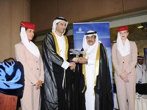 Ahmed Khoory presents Abdulla Al Tassan with a crystal Emirates A380 aircraft