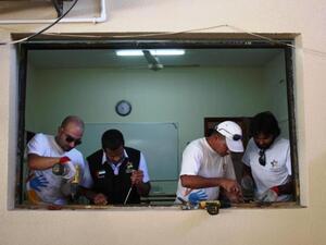 Dubai Cares volunteers installing new windows at Manar Al Iman Private School in Ajman