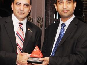 George DeBono, General Manager, Middle East & Africa at Red Hat presenting the 2011 JBoss Innovation award to Neetan Chopra, Vice President of Strategy and Architecture, Emirates Group Information Technology 