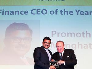 Mr. Promoth Manghat, CEO, UAE Exchange, receiving the award from Mr. Andrew Neil, Chairman, ITP Publishing, the BBC Broadcaster and former Sunday Times editor - “Photograph, courtesy of ITP Executive Publishing”