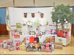 Khalil Saqer and two CSR representatives of Dubai Customs
