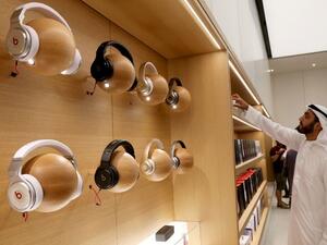 A customer looks at products displayed during the opening day of an Apple store at the Mall of the Emirates in Dubai on October 29, 2015. (AFP/ File) A customer looks at products displayed during the opening day of an Apple store at the Mall of the Emirates in Dubai on October 29, 2015. (AFP/ File)