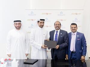 Saud Abu Al Shawareb, Abdulla Belhoul, Yousuf Ali M.A and Salim M.A during the signing agreement.