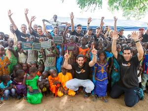 Volunteers with Senegalese children