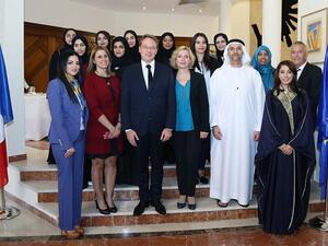 Group photo of students with Union National Bank and Al Ahli Holding Group officials.