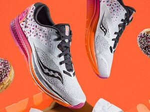 The Saucony x Dunkin' Kinarvara 9 shoes come in a box modeled after a Dunkin' Donuts box and feature the colors of the eatery's logo and a sprinkle-inspired design. (Courtesy of Saucony) The Saucony x Dunkin' Kinarvara 9 shoes come in a box modeled after a Dunkin' Donuts box and feature the colors of the eatery's logo and a sprinkle-inspired design. (Courtesy of Saucony)