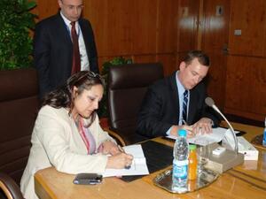 Olfat Ezzat, Chairman Assistant for HR & ENPPI Academy, and David Kraft, Middle East and Africa Sales Director for Emerson Process Management signing the MoU