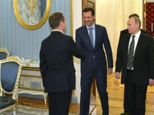 الرئيس السوري بشار الاسد خلال زيارته الى موسكو ولقائه مع بوتين