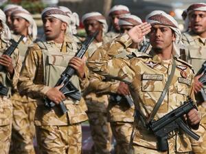 Qatari army forces take part in a military parade during the Gulf emirate's National Day celebrations in Doha on December 18, 2013. (AFP/Karim Jaafar)