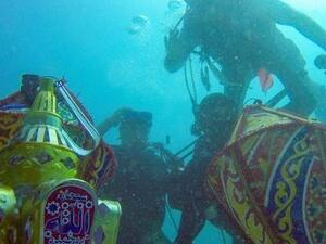 Yaheya Ashfaq, Umer Jan and Qazi Ajma, three Pakistani divers living in Saudi Arabia, filmed themselves praying underwater to welcome the month of Ramadan. (Facebook)