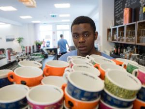 Daniel Bapinga from DR Congo prepares a coffee in the lobby bar of hotel Magdas in Vienna, Austria. (Courtesy photo)
