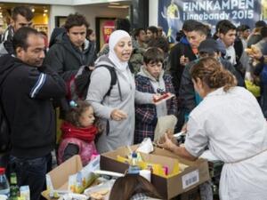 Refugees receiving emergency food upon arriving in Sweden. (AFP/File)