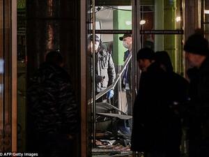 The bomb had been hidden in a locker where shoppers leave their belongings in a branch of the Perekrestok supermarket chain, according to local reports. Pictured above, investigators evaluate the scene. (AFP) 
