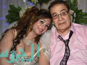 The happy couple smiles as they pose for their wedding photo. (Al Jaras Magazine)