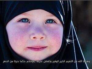 A young Chechen girl featured in a Daesh propaganda video. (Screenshot)