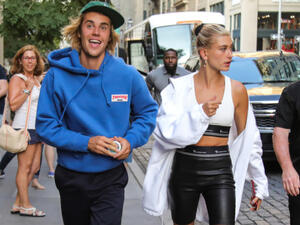 Justin Bieber and Hailey Baldwin are "enjoying the ride" that comes with their engagement (Source: Liam Goodner / Shutterstock )